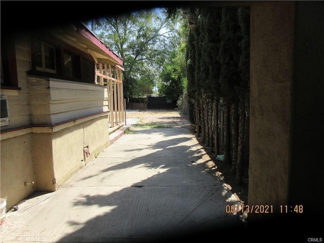 view of side of property featuring fence