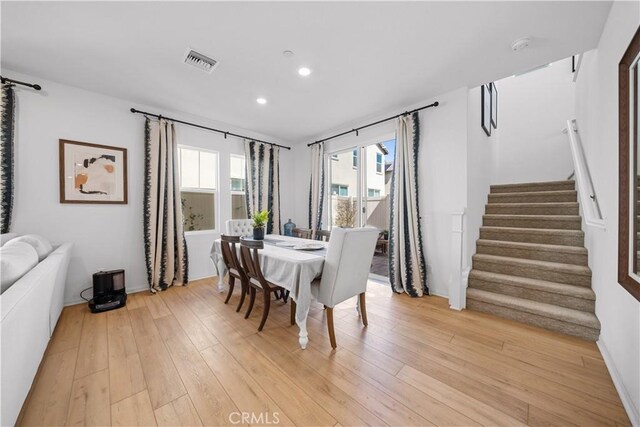 dining area with stairs, recessed lighting, visible vents, and light wood finished floors