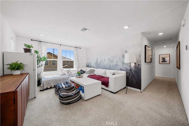 living area with recessed lighting, visible vents, and light colored carpet