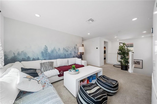 living area featuring recessed lighting, light colored carpet, and visible vents