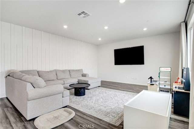 living area featuring recessed lighting, wood finished floors, and visible vents