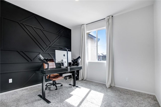 carpeted home office featuring baseboards