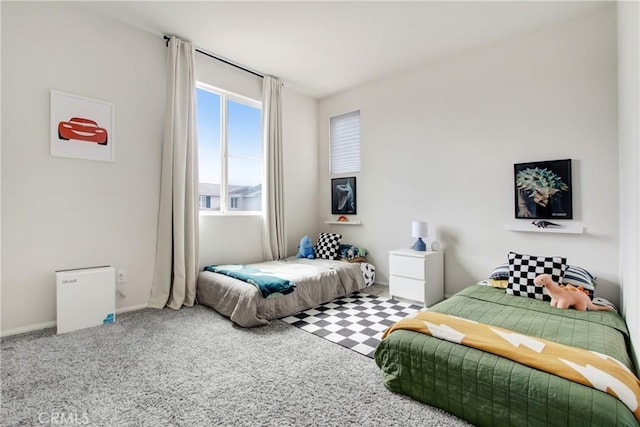 bedroom featuring baseboards and carpet floors