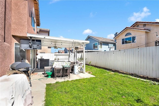 view of yard featuring a patio and a fenced backyard