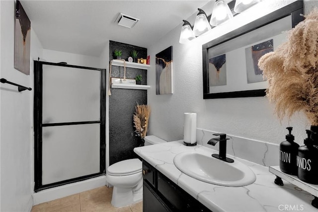 full bathroom featuring visible vents, a shower stall, toilet, tile patterned floors, and vanity