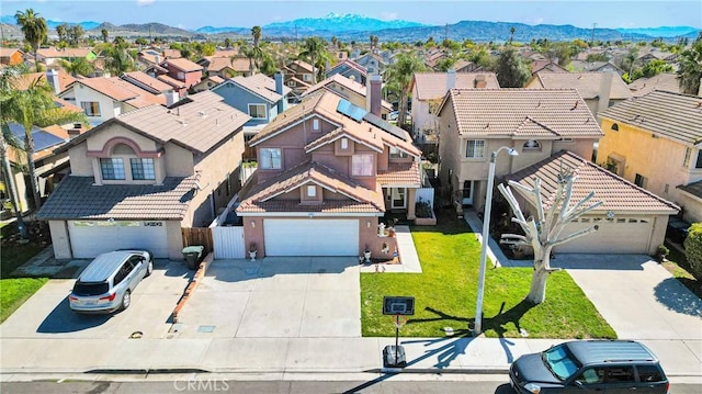 drone / aerial view featuring a mountain view and a residential view