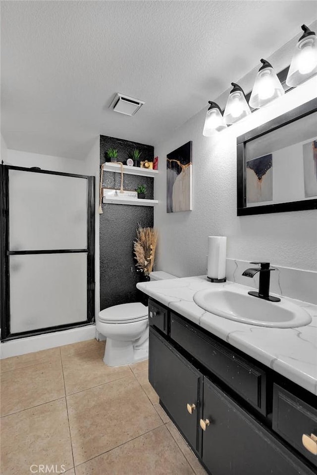 bathroom featuring tile patterned floors, visible vents, toilet, a textured ceiling, and a shower stall