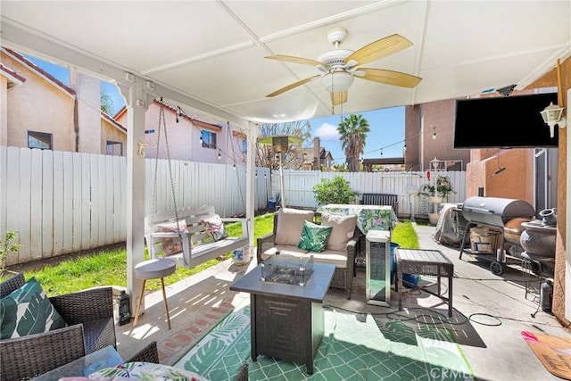 view of patio / terrace featuring a ceiling fan, an outdoor living space with a fire pit, a fenced backyard, and a grill