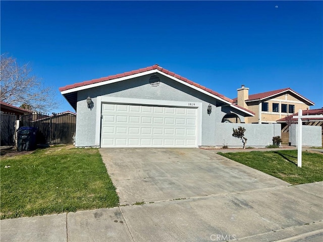 ranch-style house featuring a front lawn, fence, concrete driveway, stucco siding, and a garage