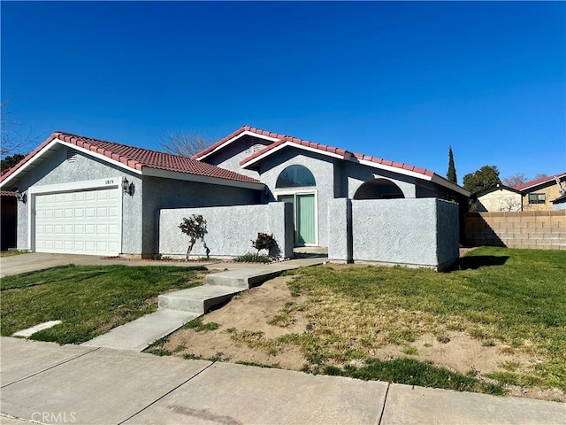 view of front facade with stucco siding, a tile roof, fence, concrete driveway, and a garage