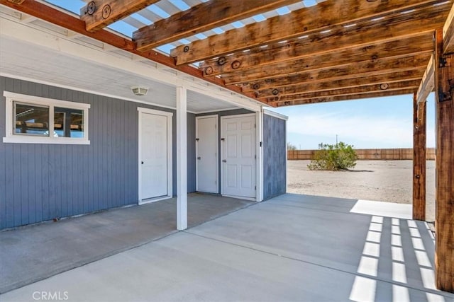 view of patio / terrace with a pergola and fence