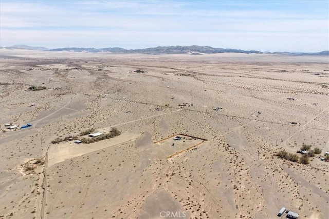 bird's eye view with a rural view, a mountain view, and a desert view