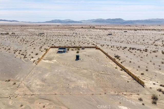 drone / aerial view with a mountain view, a rural view, and a desert view