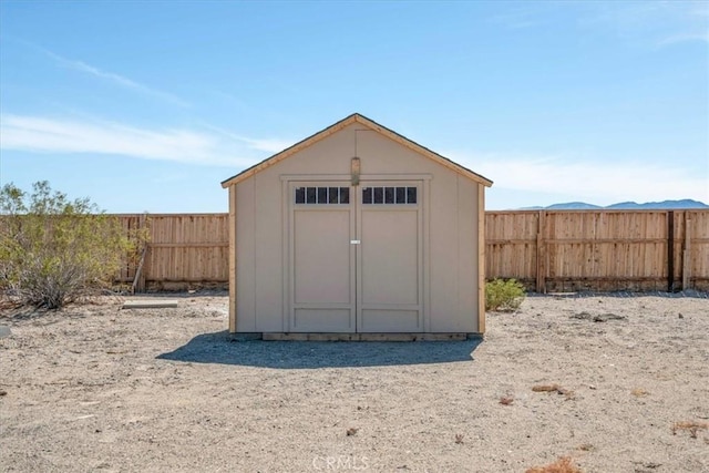 view of shed featuring a fenced backyard