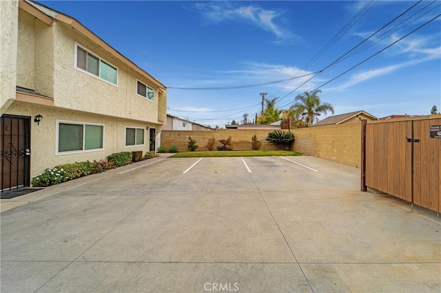 uncovered parking lot with fence