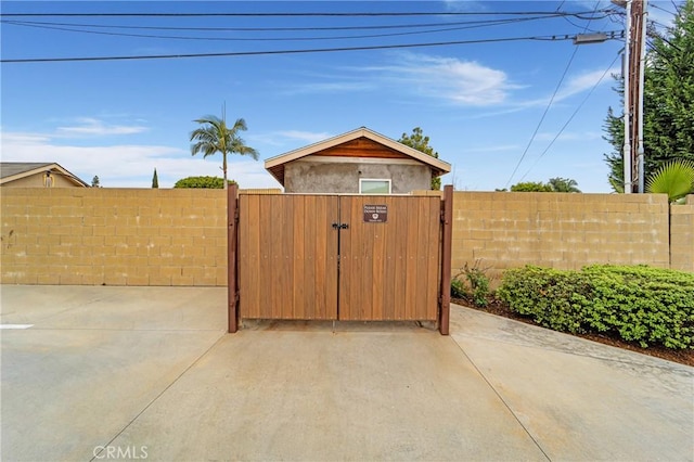 view of patio with fence private yard and a gate