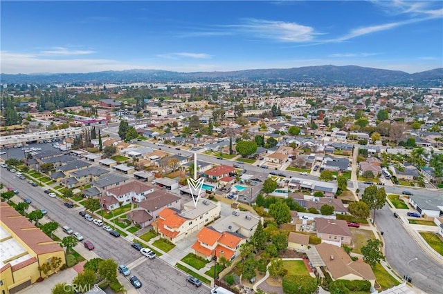 drone / aerial view featuring a mountain view and a residential view