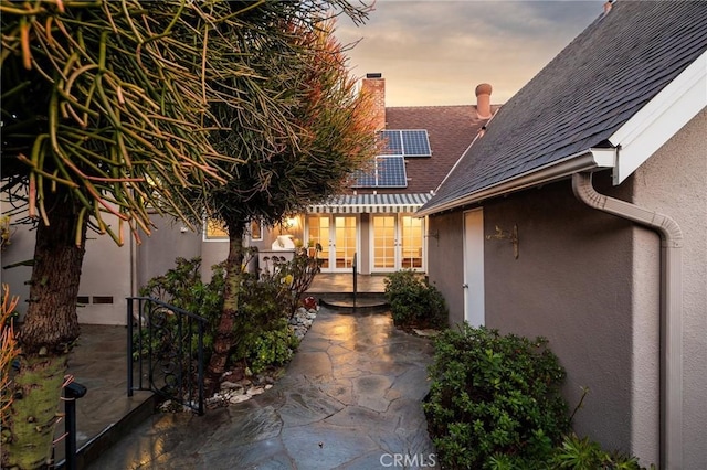 patio terrace at dusk with french doors