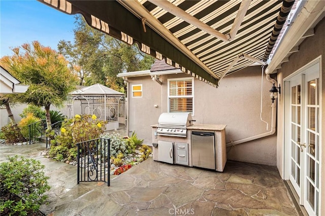 view of patio with french doors and a grill