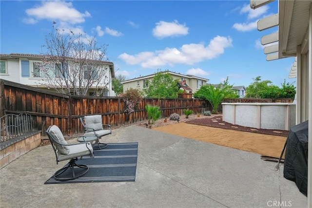 view of patio with a fenced backyard