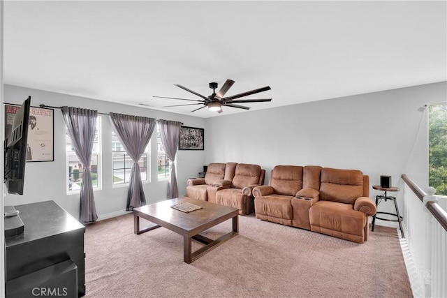 carpeted living room featuring ceiling fan