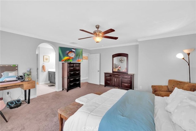 bedroom with ornamental molding, arched walkways, carpet, baseboards, and ceiling fan