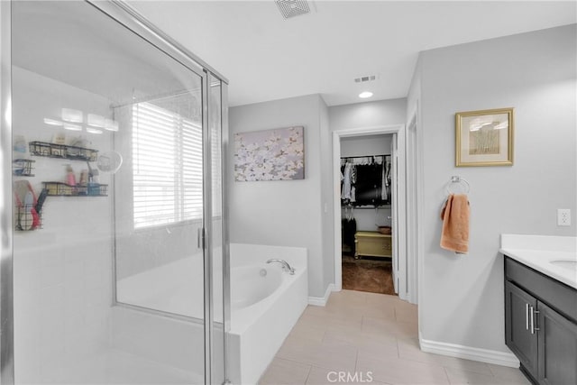 full bath with vanity, visible vents, a stall shower, tile patterned flooring, and a bath