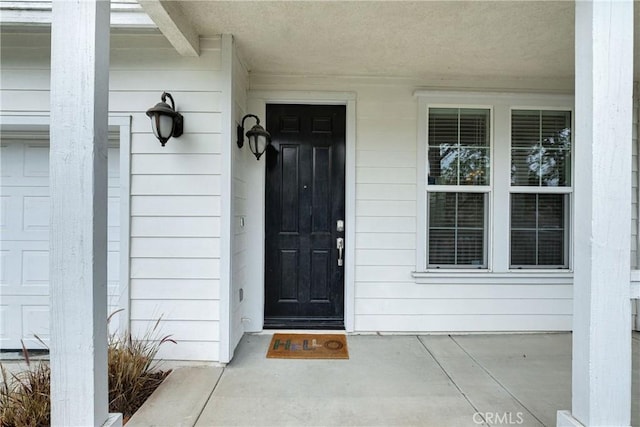 property entrance with covered porch