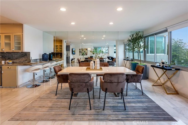 dining area featuring recessed lighting