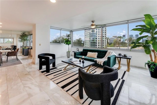 living room featuring a city view, recessed lighting, and ceiling fan