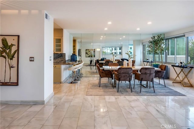 dining space with recessed lighting, visible vents, and baseboards