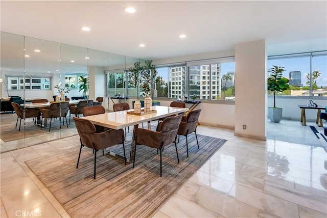 dining space with recessed lighting