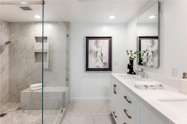 full bathroom with a marble finish shower, visible vents, baseboards, marble finish floor, and a sink