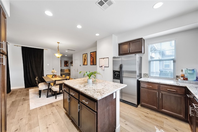 22331 Blue Lupine Cir, Grand Terrace, CA 92313 - kitchen with stainless steel refrigerator with ice dispenser, dark brown cabinetry, light wood finished floors, recessed lighting, and pendant lighting