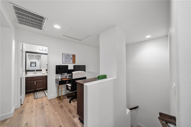 22331 Blue Lupine Cir, Grand Terrace, CA 92313 - office area featuring light wood-style flooring, attic access, recessed lighting, and a sink