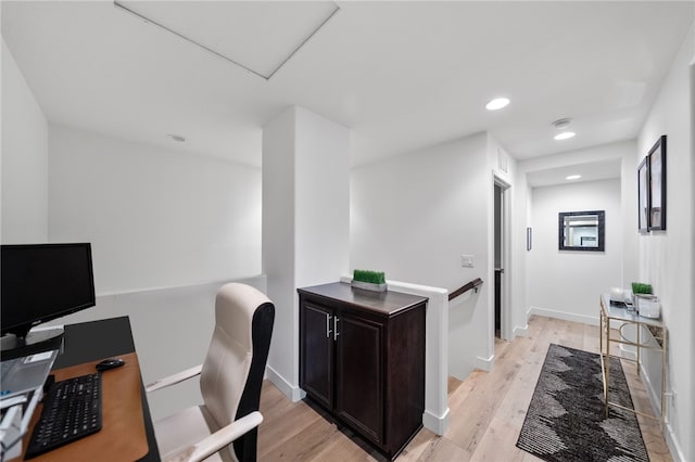 home office featuring recessed lighting, light wood-style flooring, and baseboards