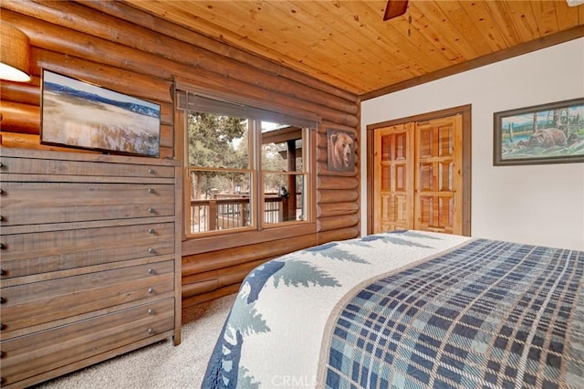 bedroom featuring wood ceiling and carpet