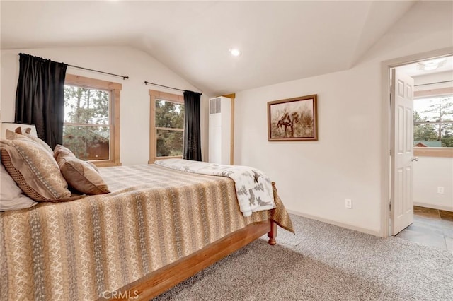 carpeted bedroom featuring multiple windows, baseboards, and lofted ceiling