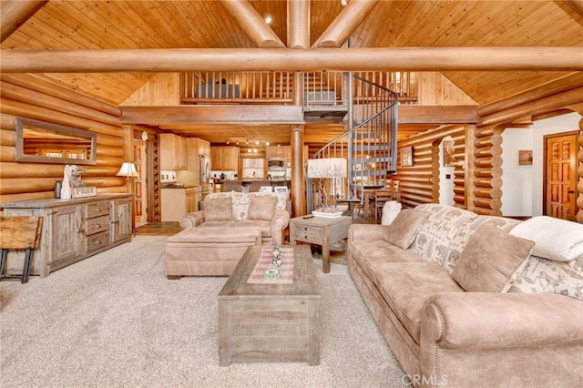 carpeted living area with stairway, beam ceiling, high vaulted ceiling, and wooden ceiling