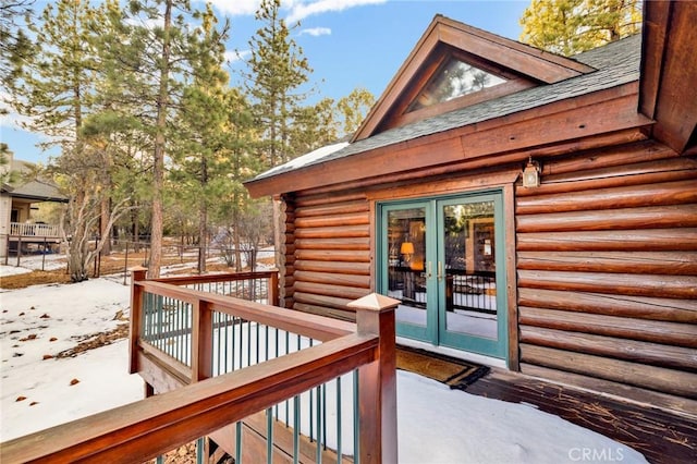 wooden deck featuring french doors