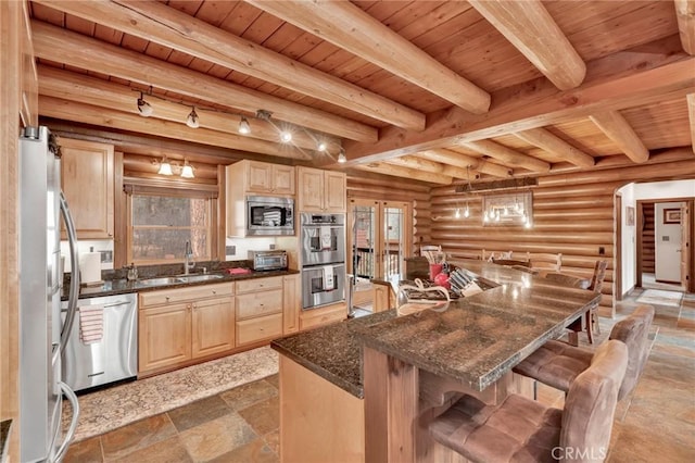 kitchen with wood ceiling, appliances with stainless steel finishes, light brown cabinetry, and a sink