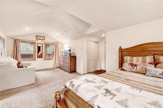 bedroom featuring light colored carpet, baseboards, and vaulted ceiling