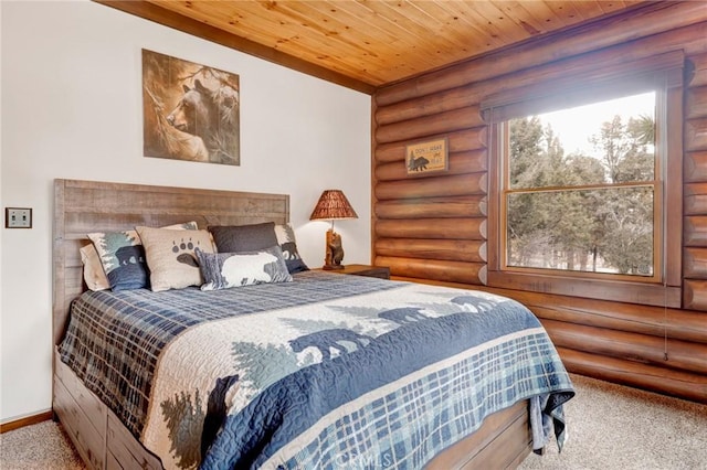 carpeted bedroom with baseboards and wood ceiling