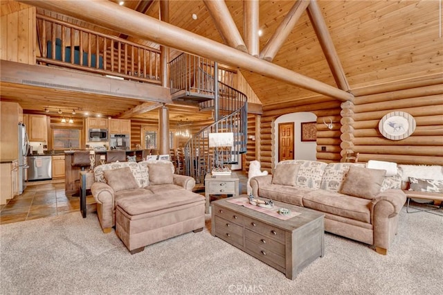 living area featuring light colored carpet, high vaulted ceiling, wood ceiling, and stairs