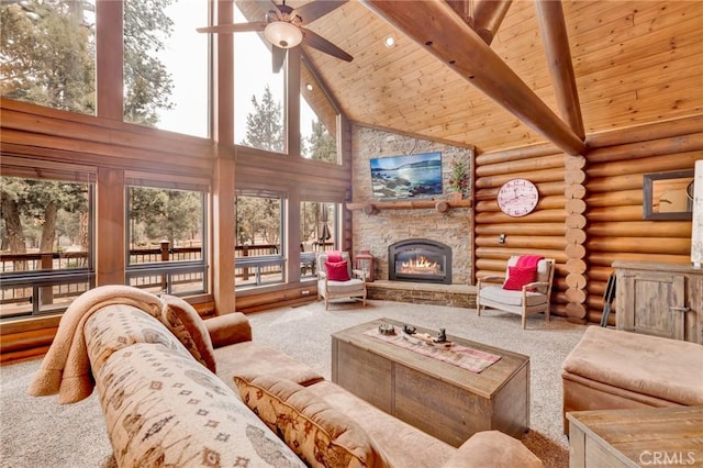 living room with beam ceiling, high vaulted ceiling, rustic walls, a fireplace, and carpet flooring