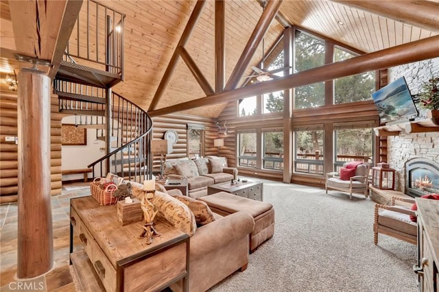 living room with beamed ceiling, stairway, wood ceiling, a fireplace, and high vaulted ceiling