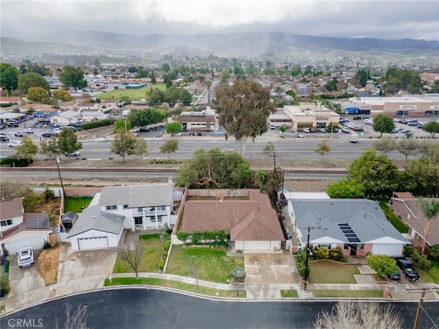 drone / aerial view with a mountain view and a residential view