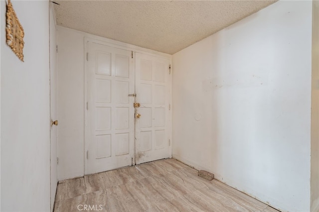 empty room with a textured ceiling