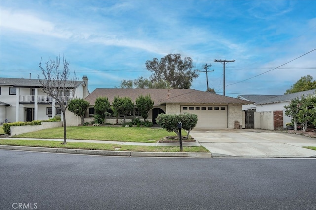 view of front of property with brick siding, driveway, a front yard, and a garage