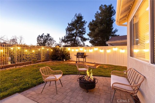 view of patio / terrace featuring a fire pit and a fenced backyard